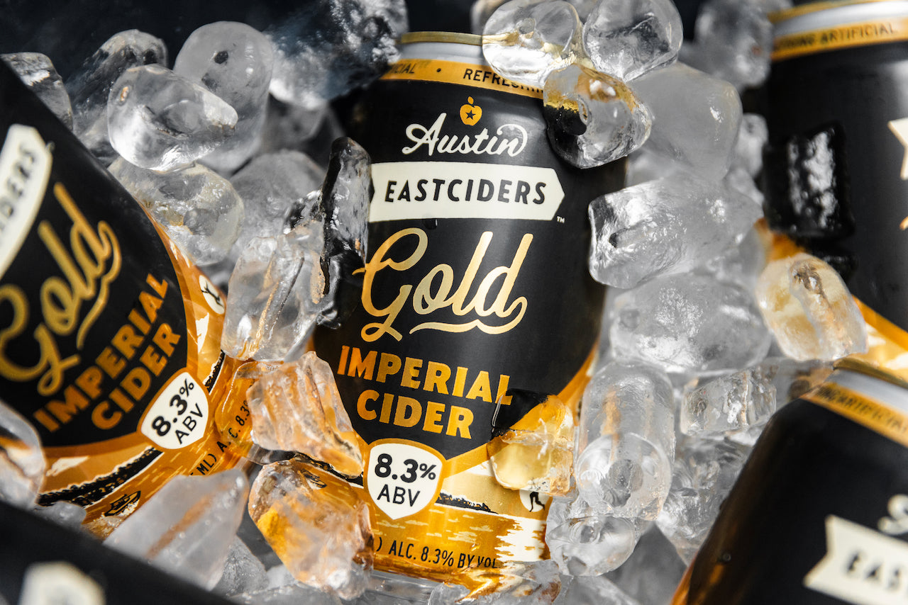 Several Eastciders Imperial Gold cans nestled in ice
