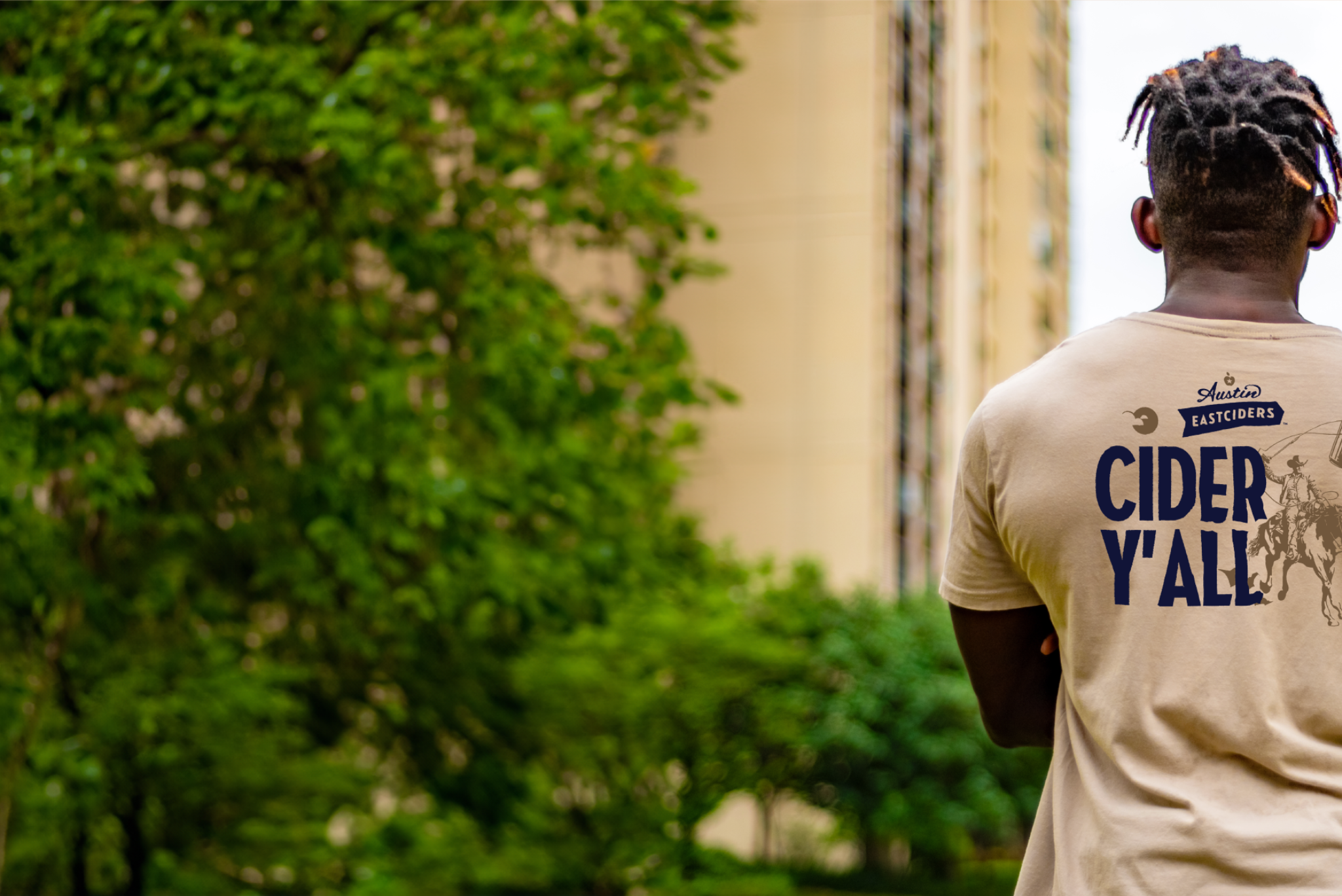 Man Facing backwards with Austin Eastciders shirt on